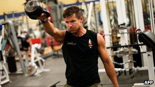 In this image obtained from www.redbullcontentpool.com, pilot Felix Baumgartner works out in a gym on October 7, 2012