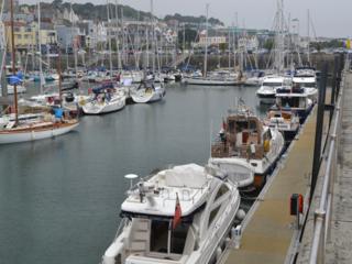 Guernsey harbour with boats in it