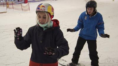 Aimee Fuller gives BBC Radio 1Xtra DJ Nick Bright a snowboarding lesson