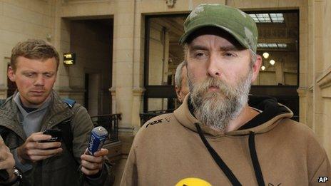 Norwegian Kristian Vikernes, 40, arrives at a Paris courthouse to answer charges of allegedly inciting racial hatred and other charges (17 October 2013)