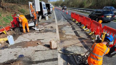 National Highways workers repairing a road