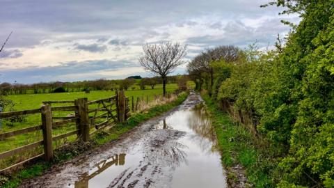 Rain bearing clouds over partially flooded fields in Chorley, Lancashire.