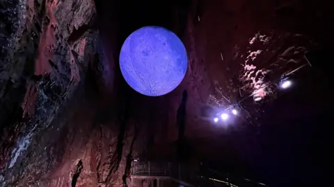 A model of the moon hanging in Chamber 9 at Wookey Hole Caves