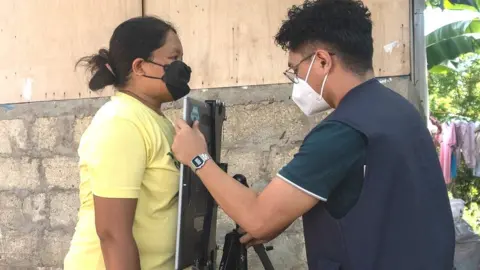 A chest X-ray being performed remotely in the Philippines