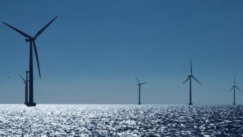 Five wind turbines in an offshore wind farm