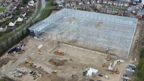 Aerial footage of a Corby warehouse at the centre of a planning row