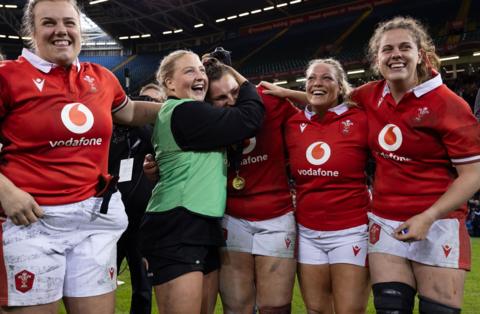 Wales players celebrate at the end of the game