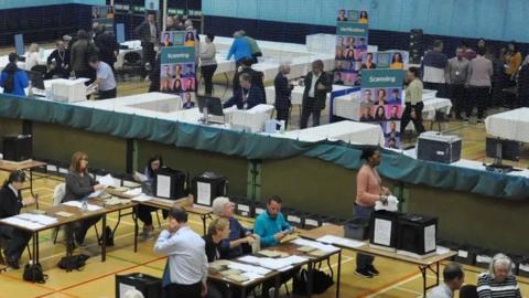 Ballot count takes place in a sports hall
