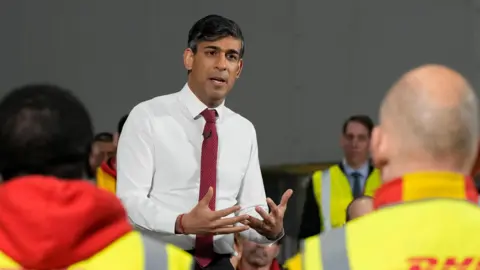 Rishi Sunak making a speech at DHL factory