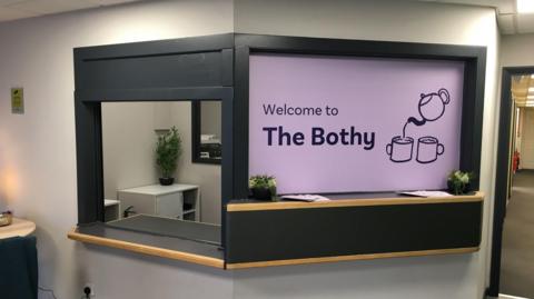 Reception desk with branding which says "Welcome to The Bothy"