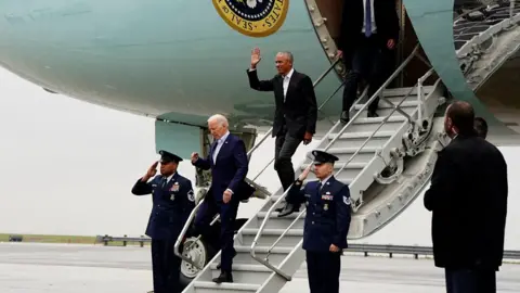 Joe Biden and Barack Obama getting off Air Force One in New York