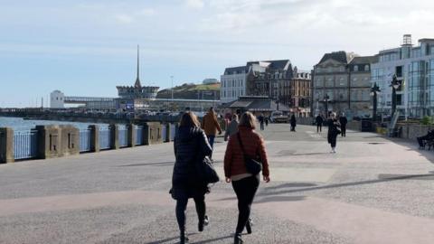 People walking on Douglas Promenade