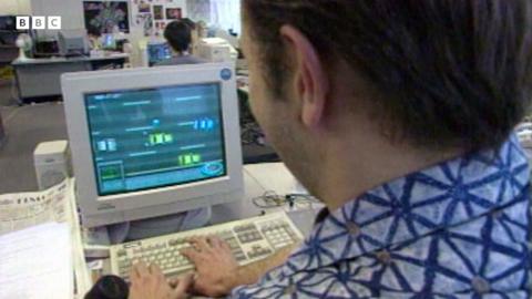 A programmer at DMA Design works on a PC, making the new Grand Theft Auto game
