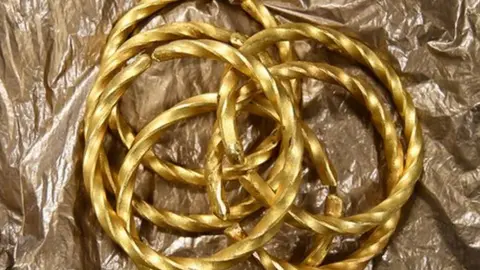 Six gold bracelets police say the suspects made using the stolen gold