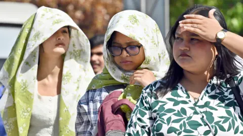 Three women in hot weather in India