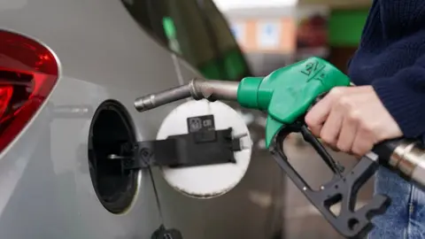 Man filling car from petrol pump