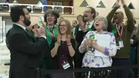 Green councillors applaud their win