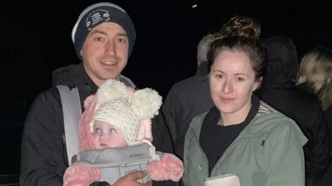 Anna Llewelyn Roberts pictured with her partner and young daughter Erin