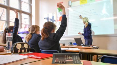 A teacher and students in a classroom