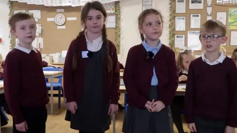 Primary school students in year 2 recite Sycamore Gap poem