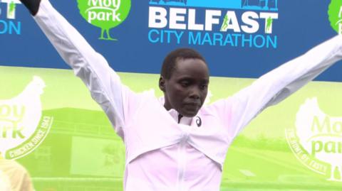 Beatrice Jepkemei celebrates after her Belfast Marathon triumph