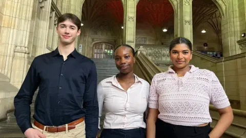 A picture of the three students (Harvey Hill, Elizabeth Maregere and Mariana Wickramarachchi) standing in the foyer of the Wills Memorial Building. 