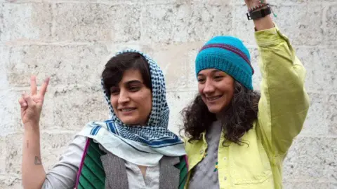 Elaheh Mohammadi (L) and Niloufar Hamedi (R) pose for a photo after being released from Evin prison in Tehran, Iran (14 January 2024)