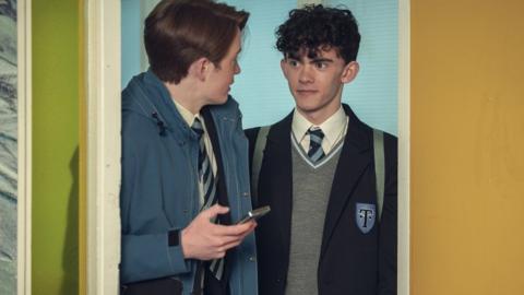Kit Connor and Joe Locke in Netflix series, Heartstopper wearing school uniforms