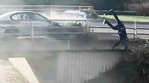 Motorcyclist falling over a bridge after being run off the road by a car.