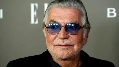Close up of Italian fashion designer Roberto Cavalli wearing sunglasses