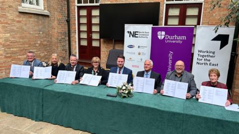 North East council leaders and Levelling Up minister Jacob Young signing the deal