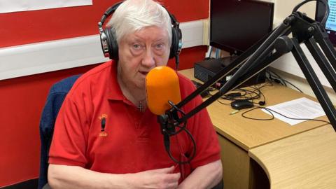 Norman Johnson in a radio studio