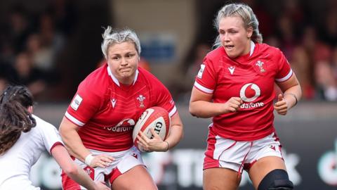 Hannah Bluck and Alex Callender in action for Wales