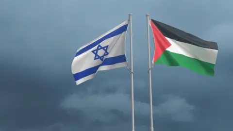 A stock image showing Palestinian and Israeli flags against an overcast sky