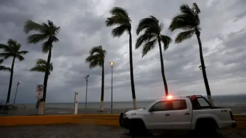 Palm trees sway in the wind as Hurricane Lidia hits Mexico's Pacific coast in Puerto Vallarta