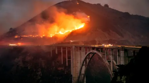 Colorado Fire burns down toward the Bixby Bridge in Big Sur, California. Photo: 22 January 2022