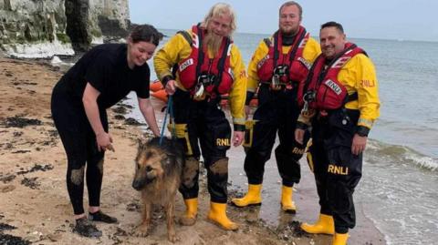 RNLI crew with rescued dog
