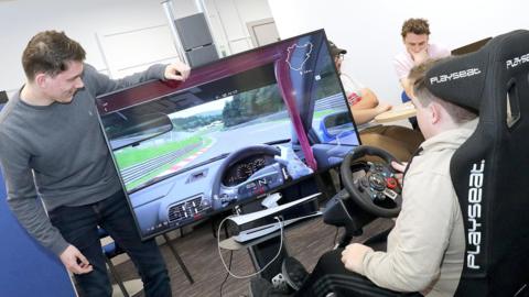 Two students on Esports racing simulator 