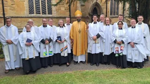 Bishop of Loughborough, Right Reverend Saju Muthalaly, with members of the clergy