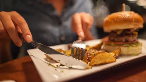 Woman eating burger