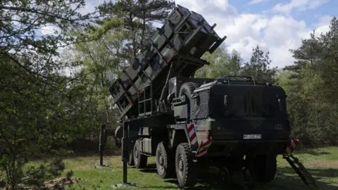 A launcher of a Patriot missile system of the Bundeswehr, the German armed forces, stands during the "National Guardian" military exercise at the Bundeswehr's tank training grounds on April 18, 2024 in Munster, Germany