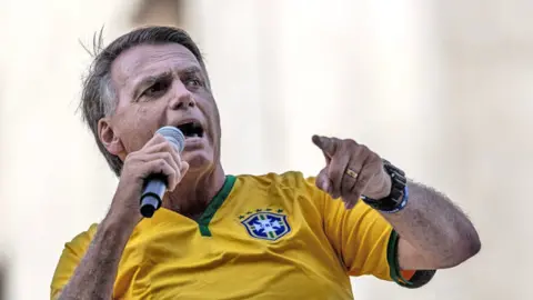 Jair Bolsonaro, Brazil's former president, gives a speech to supporters during a march on Avenida Paulista in Sao Paulo, Brazil, on Sunday, Feb. 25, 2024.