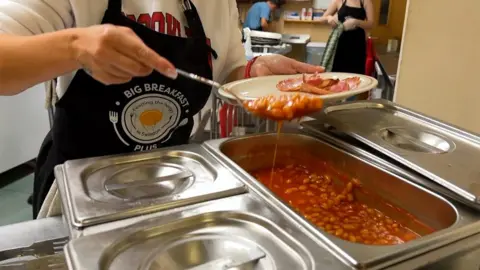 A load of baked beans being served up