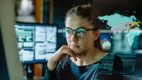 Stock image of woman looking at a screen