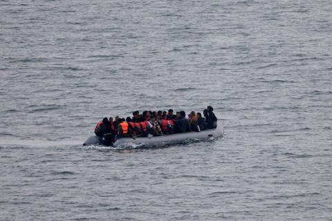 Migrants at sea in the English Channel in an inflatable boat