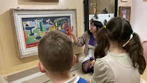 Children looking at art