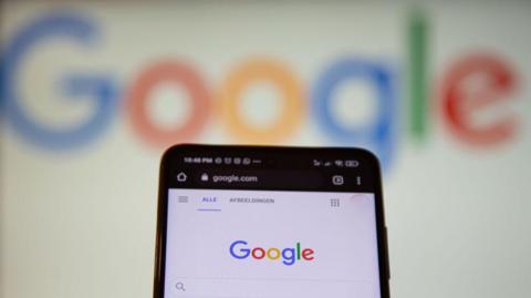 An image of a phone being used to search Googlegle