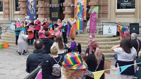 A choir sings during a Suffolk Pride event in Ipswich