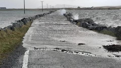 Balesear causeway overtopped by waves and debris
