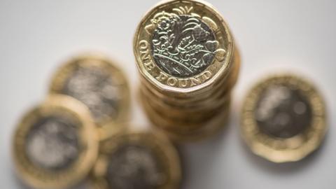 Pound coins piled up